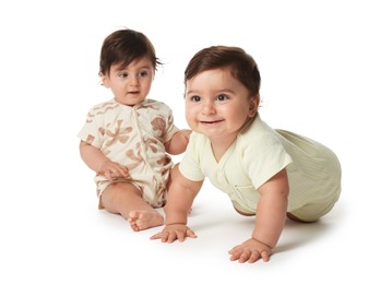 Photo of Cute little twin babies on white background