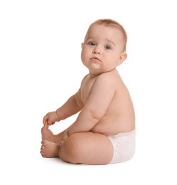 Photo of Cute little baby in diaper sitting on white background