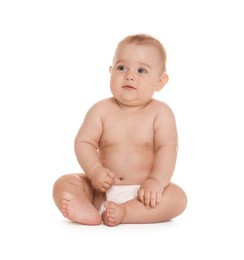 Photo of Cute little baby in diaper sitting on white background