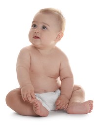 Photo of Cute little baby in diaper sitting on white background