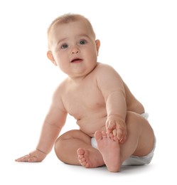 Photo of Cute little baby in diaper sitting on white background
