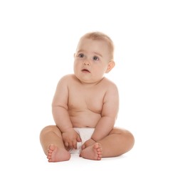 Photo of Cute little baby in diaper sitting on white background