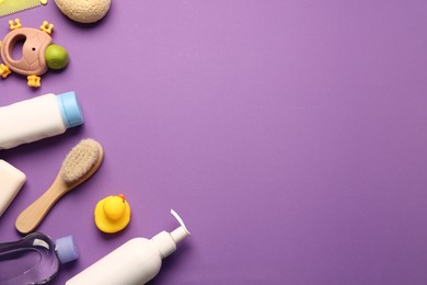 Photo of Baby bath accessories and care products on purple background, flat lay. Space for text