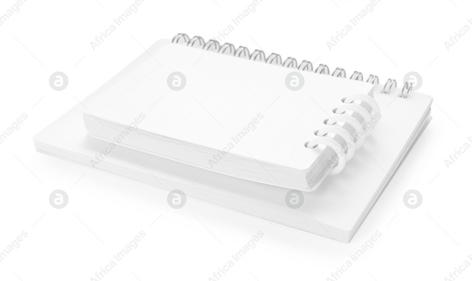 Stylish notebooks with spiral isolated on white Photo of Stylish notebooks with spiral isolated on white