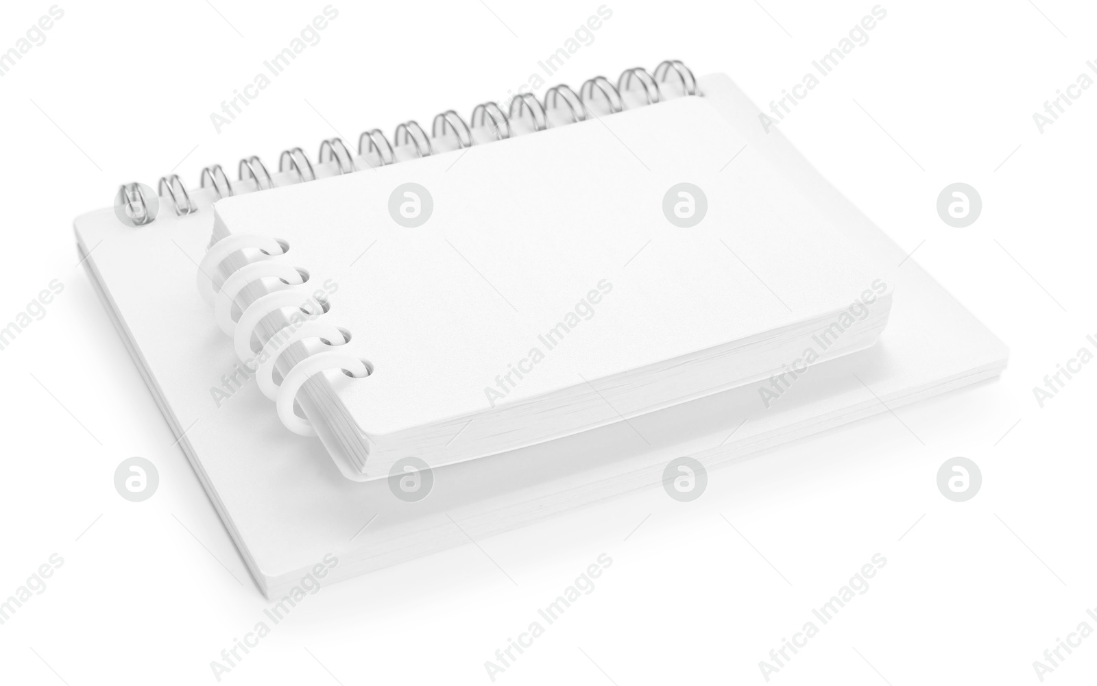 Stylish notebooks with spiral isolated on white Photo of Stylish notebooks with spiral isolated on white