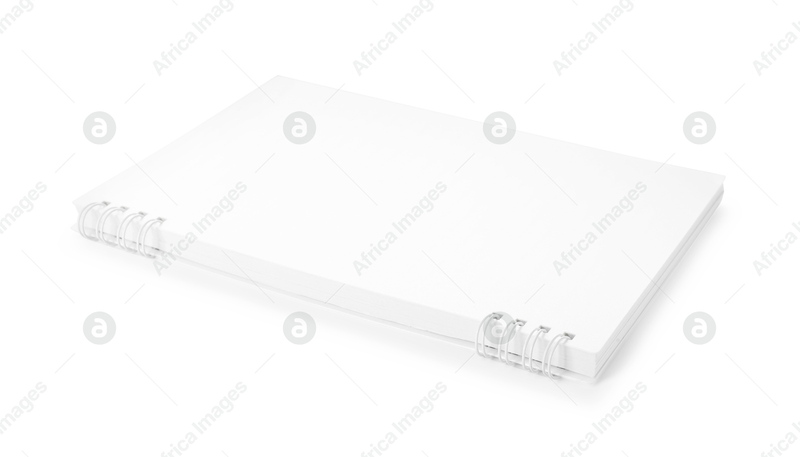 One notebook with spiral isolated on white Photo of One notebook with spiral isolated on white