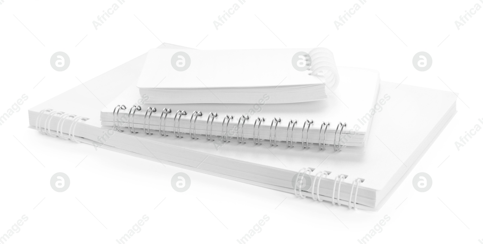 Stack of stylish notebooks isolated on white Photo of Stack of stylish notebooks isolated on white
