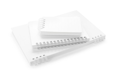 Photo of Stack of stylish notebooks isolated on white