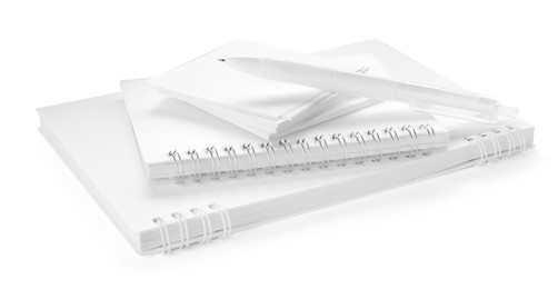Photo of Notebooks, paper notes and pen isolated on white