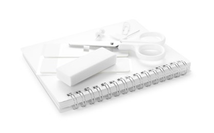 Photo of Notebook and other stationery isolated on white