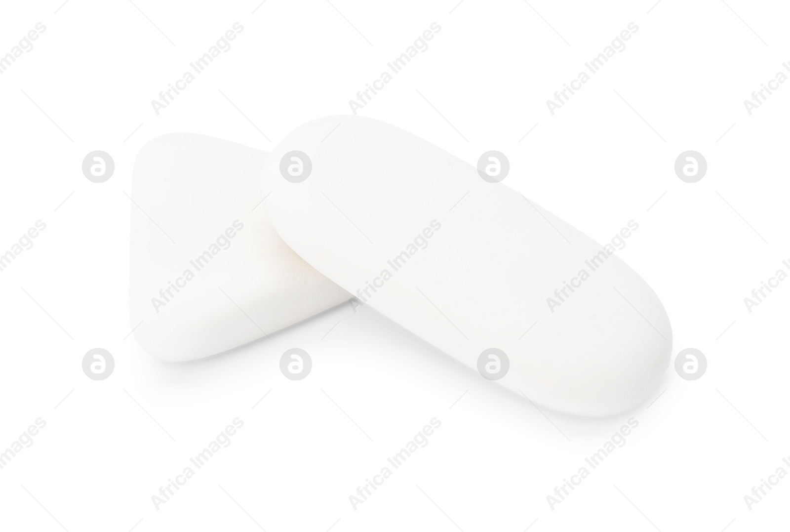 Photo of Two erasers isolated on white. Stationery for school