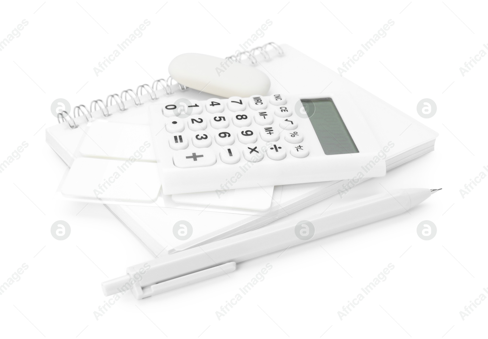 Different stationery and calculator isolated on white Photo of Different stationery and calculator isolated on white