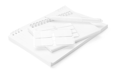Photo of Notebooks and other stationery isolated on white