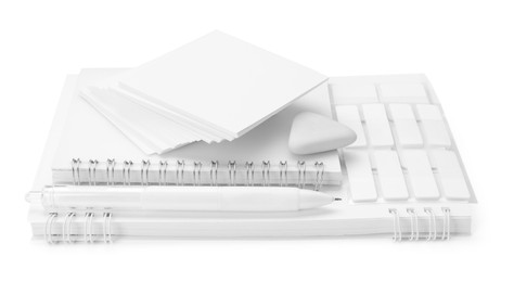 Photo of Notebooks and other stationery isolated on white