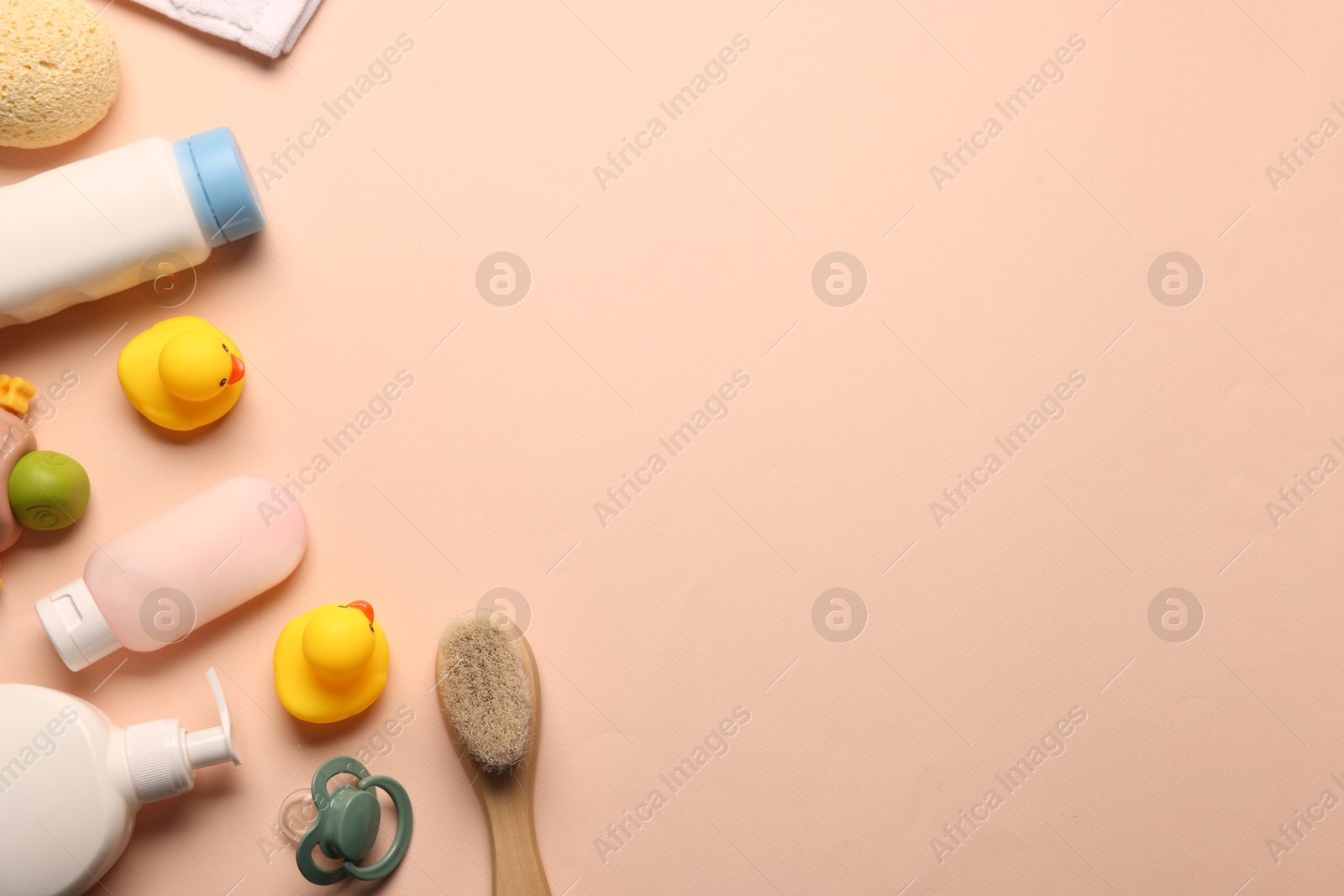 Photo of Baby bath accessories and care products on beige background, flat lay. Space for text