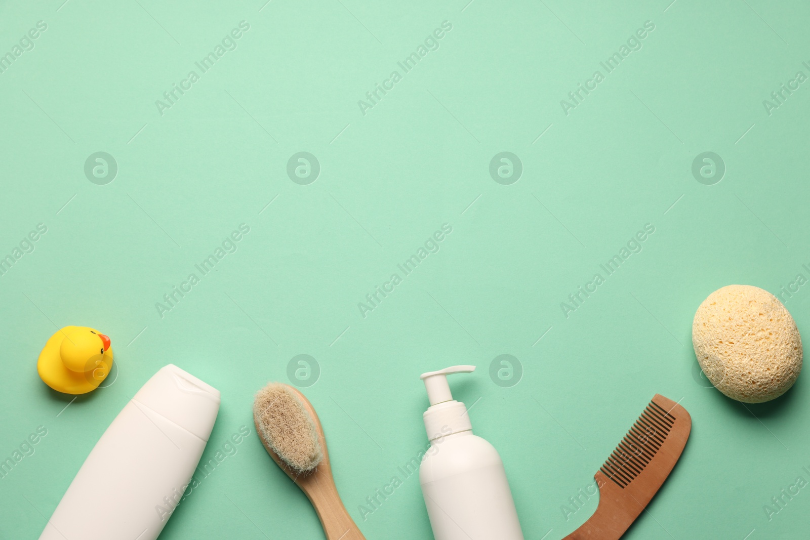 Photo of Baby bath accessories and care products on turquoise background, flat lay. Space for text