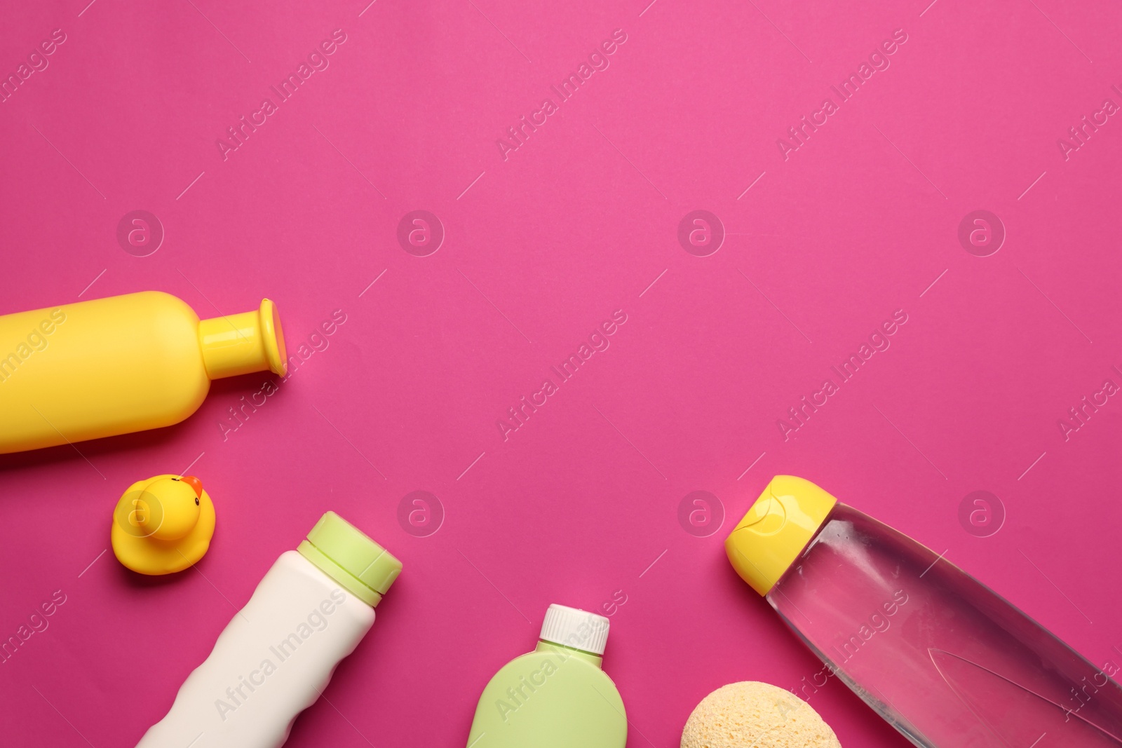 Photo of Baby bath accessories and care products on crimson background, flat lay. Space for text
