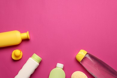 Photo of Baby bath accessories and care products on crimson background, flat lay. Space for text
