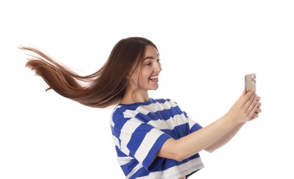 Photo of Happy woman with beautiful long hair using smartphone on white background