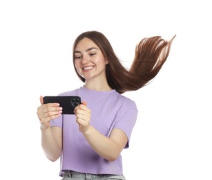 Photo of Happy woman with beautiful long hair using smartphone on white background