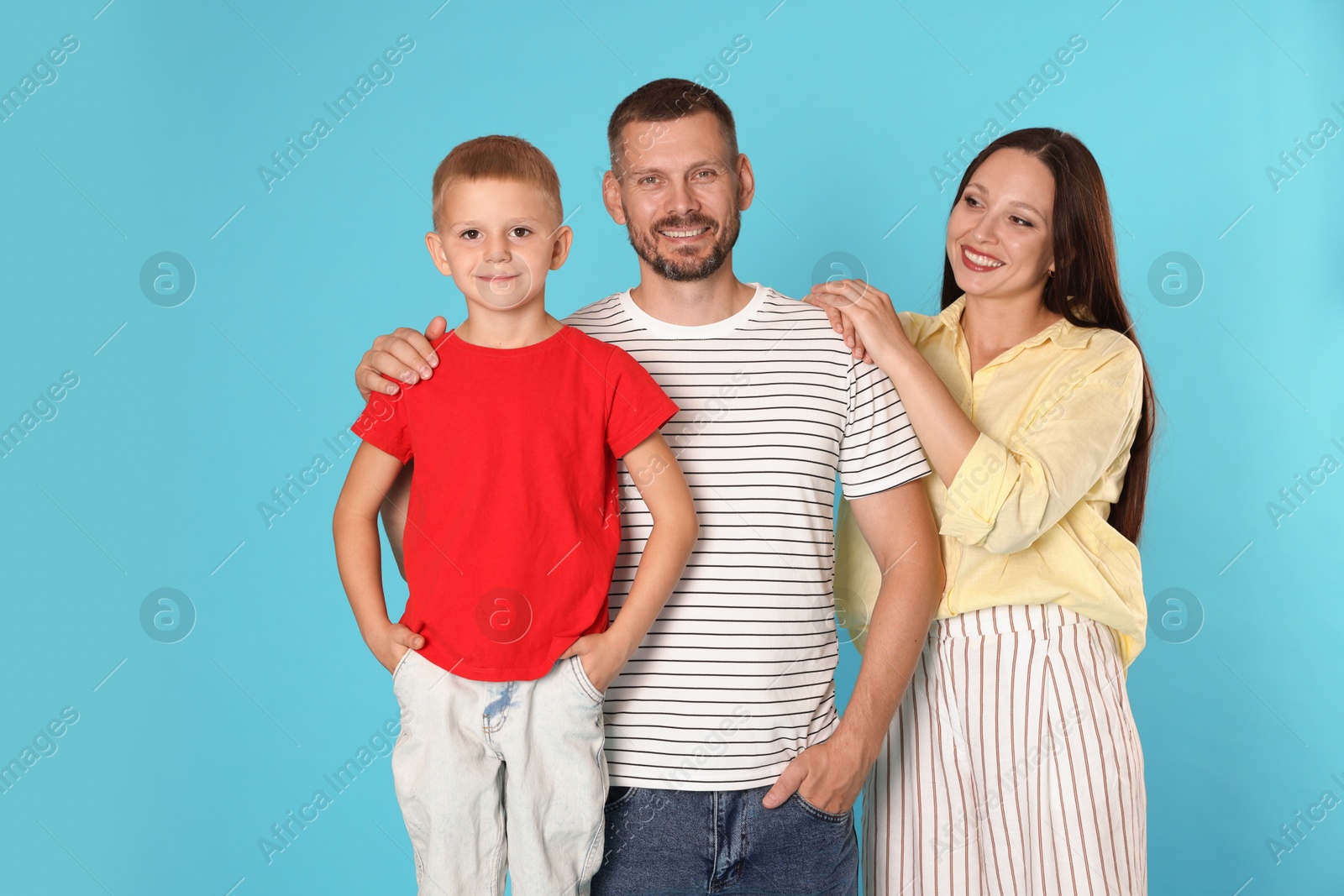 Photo of Portrait of happy family on light blue background