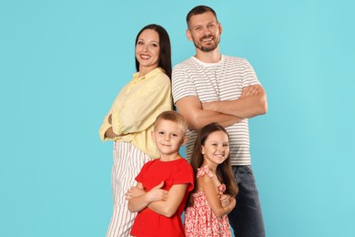 Photo of Portrait of happy family on light blue background