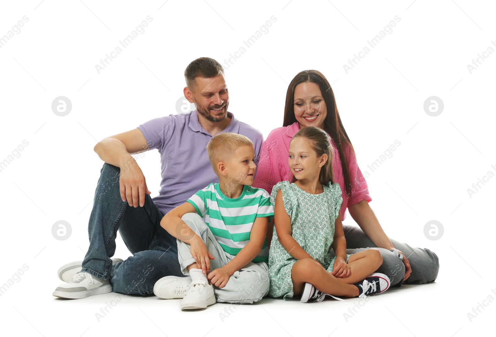 Lovely family posing together on white background Photo of Lovely family posing together on white background