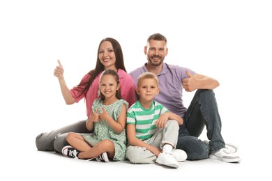 Photo of Happy family showing thumbs ups on white background