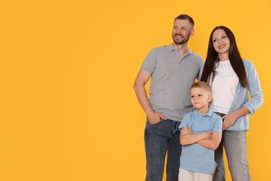 Photo of Portrait of happy family on yellow background. Space for text