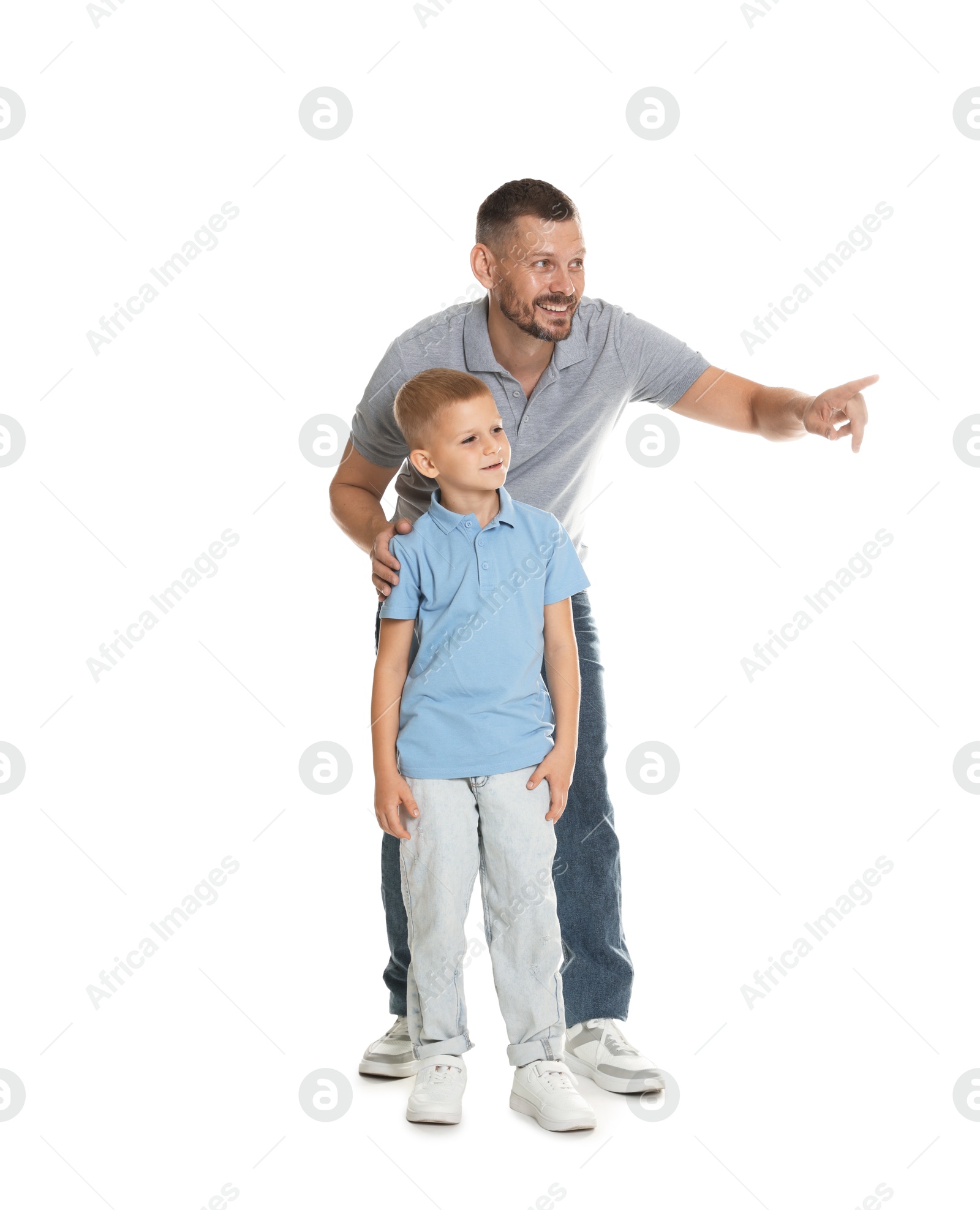 Father showing his son something on white background Photo of Father showing his son something on white background