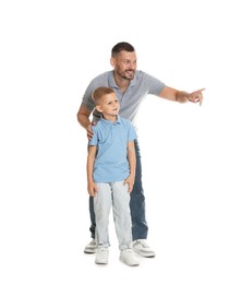 Photo of Father showing his son something on white background