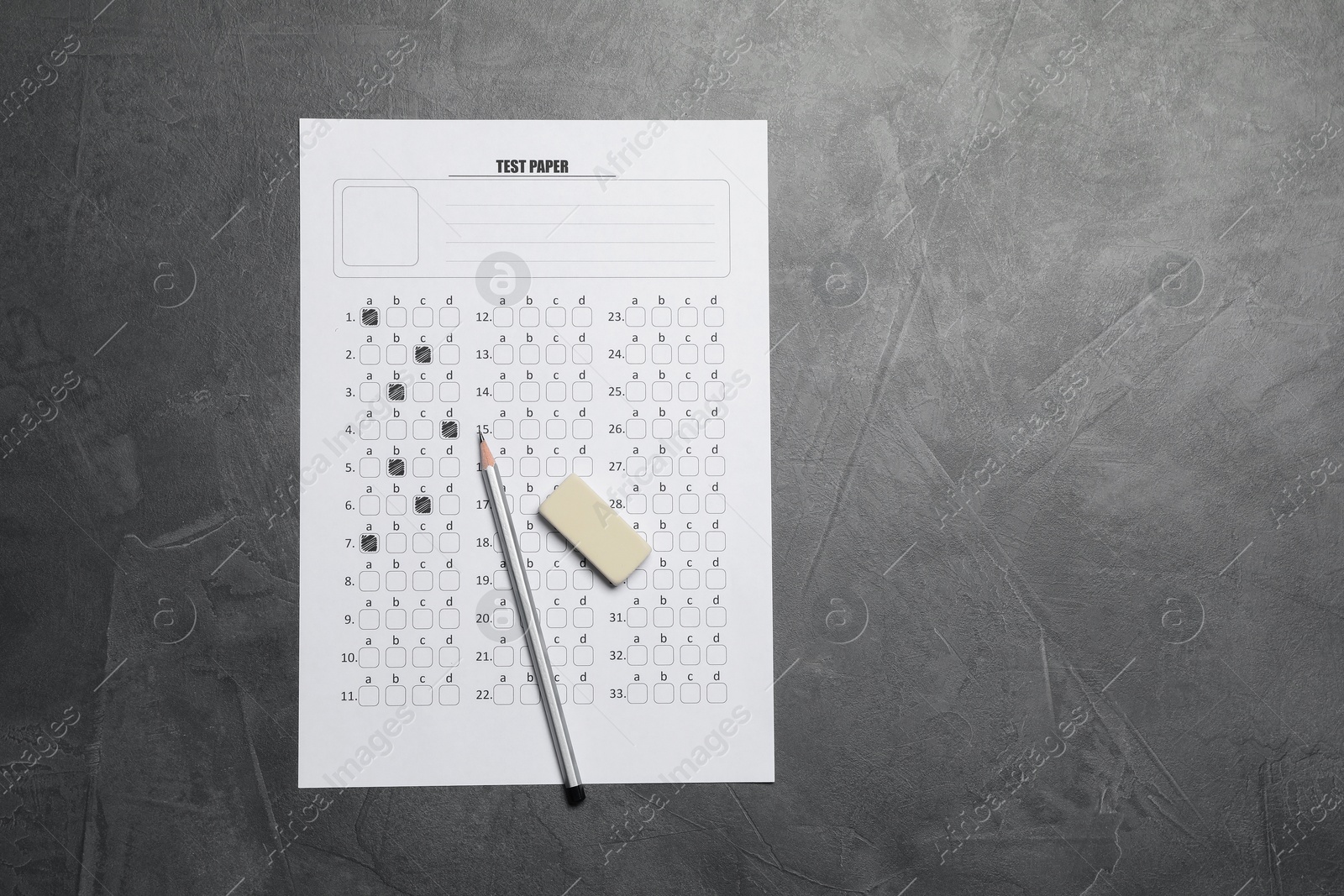 Student passing exam. Answer sheet, pencil and eraser on gray textured table, flat lay. Space for text Photo of Student passing exam. Answer sheet, pencil and eraser on gray textured table, flat lay. Space for text