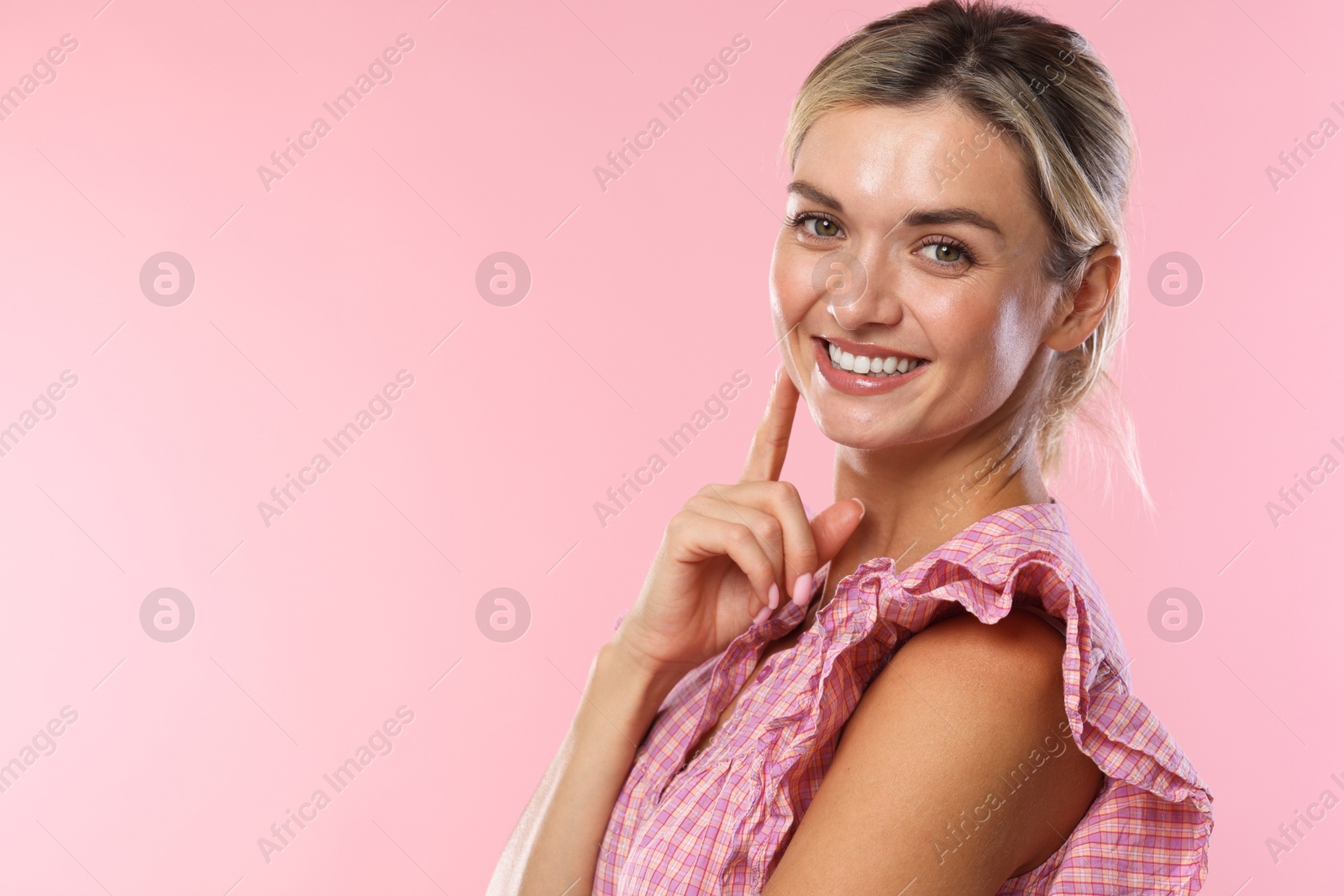 Photo of Woman with beautiful healthy teeth on pink background. Space for text