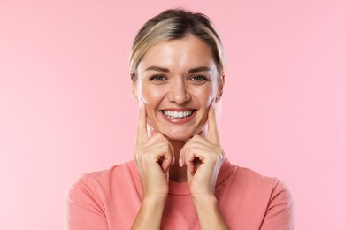 Photo of Woman with beautiful healthy teeth on pink background