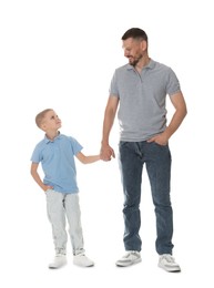 Photo of Father and son posing together on white background