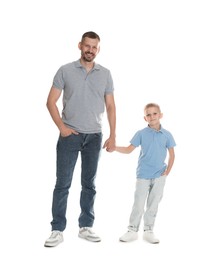 Photo of Father and son posing together on white background