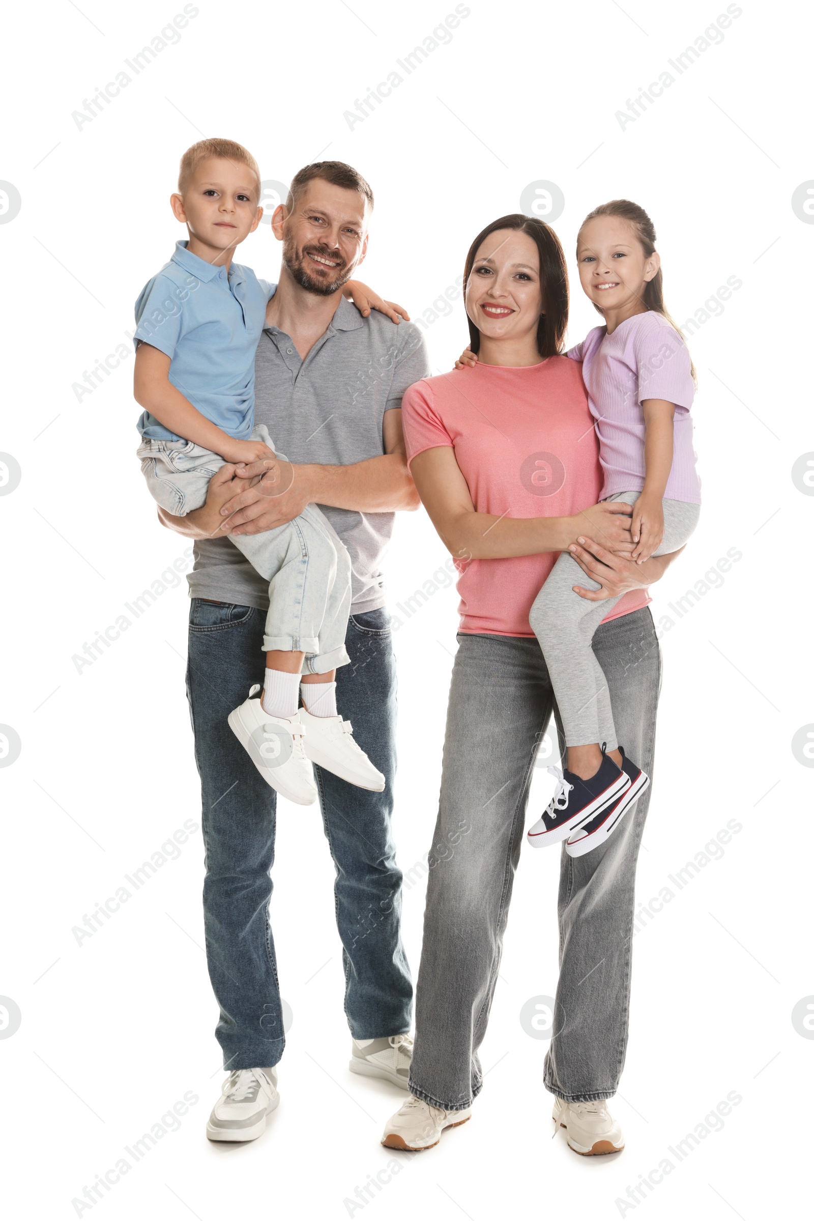 Photo of Lovely family posing together on white background