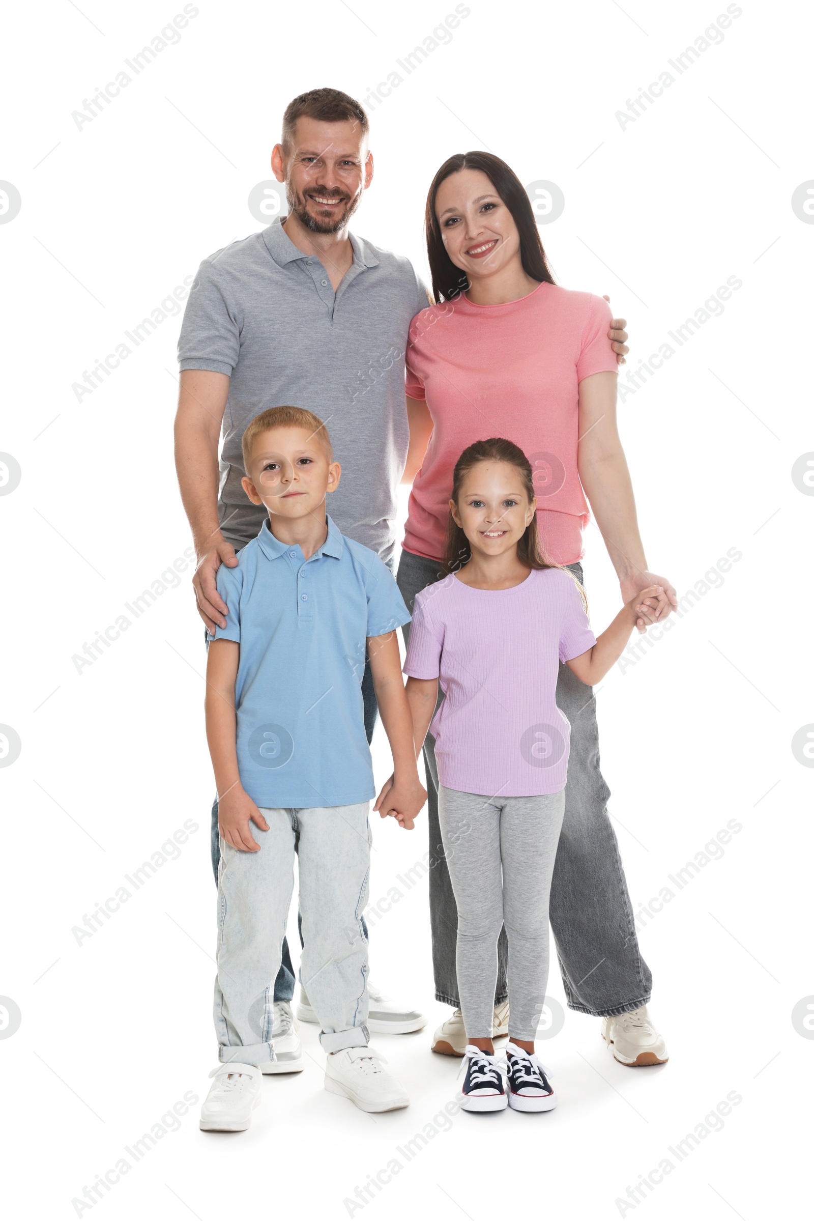 Lovely family posing together on white background Photo of Lovely family posing together on white background