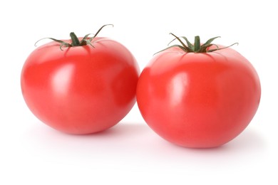 Photo of Two ripe red tomatoes isolated on white