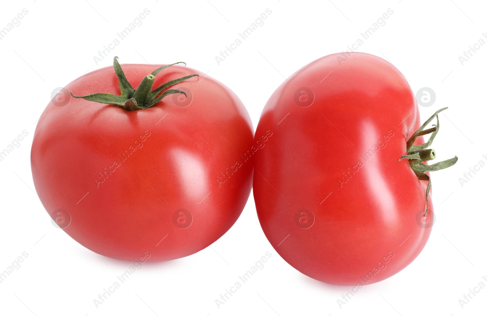 Two ripe red tomatoes isolated on white Photo of Two ripe red tomatoes isolated on white