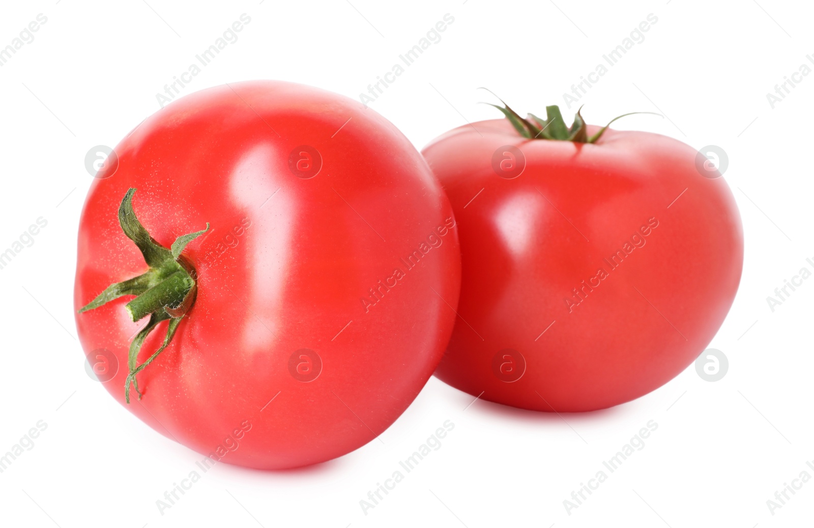 Photo of Two ripe red tomatoes isolated on white
