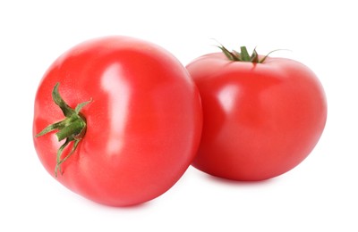 Photo of Two ripe red tomatoes isolated on white