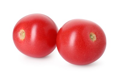 Photo of Two ripe red tomatoes isolated on white