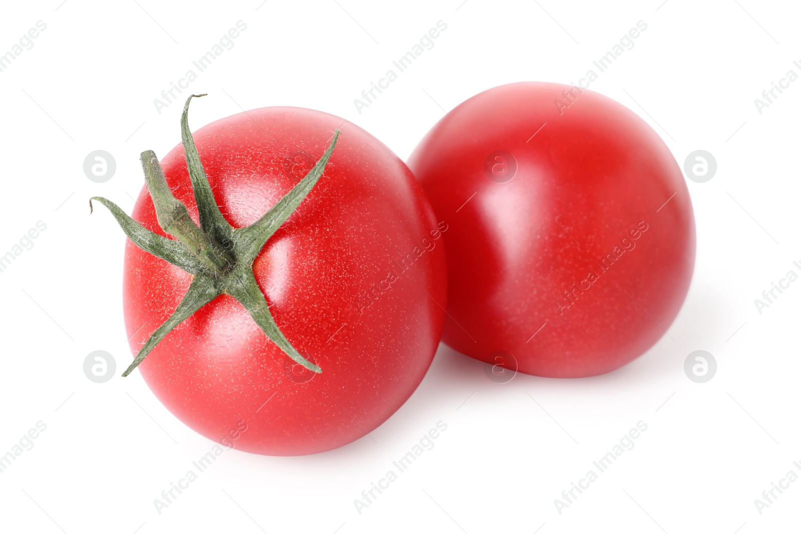 Photo of Two ripe red tomatoes isolated on white