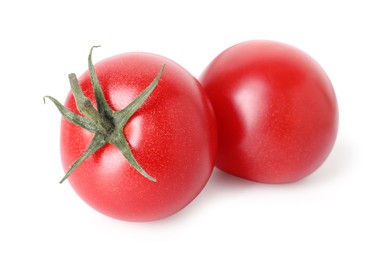 Photo of Two ripe red tomatoes isolated on white