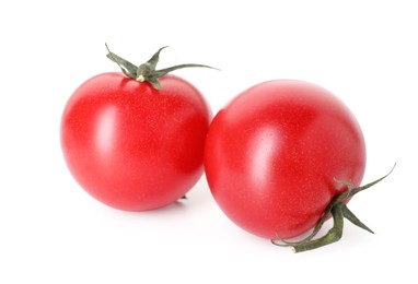 Photo of Two ripe red tomatoes isolated on white