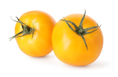 Photo of Two ripe yellow tomatoes isolated on white