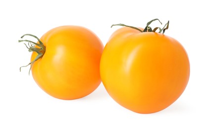 Photo of Two ripe yellow tomatoes isolated on white