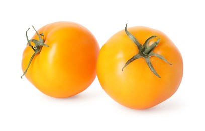 Photo of Two ripe yellow tomatoes isolated on white