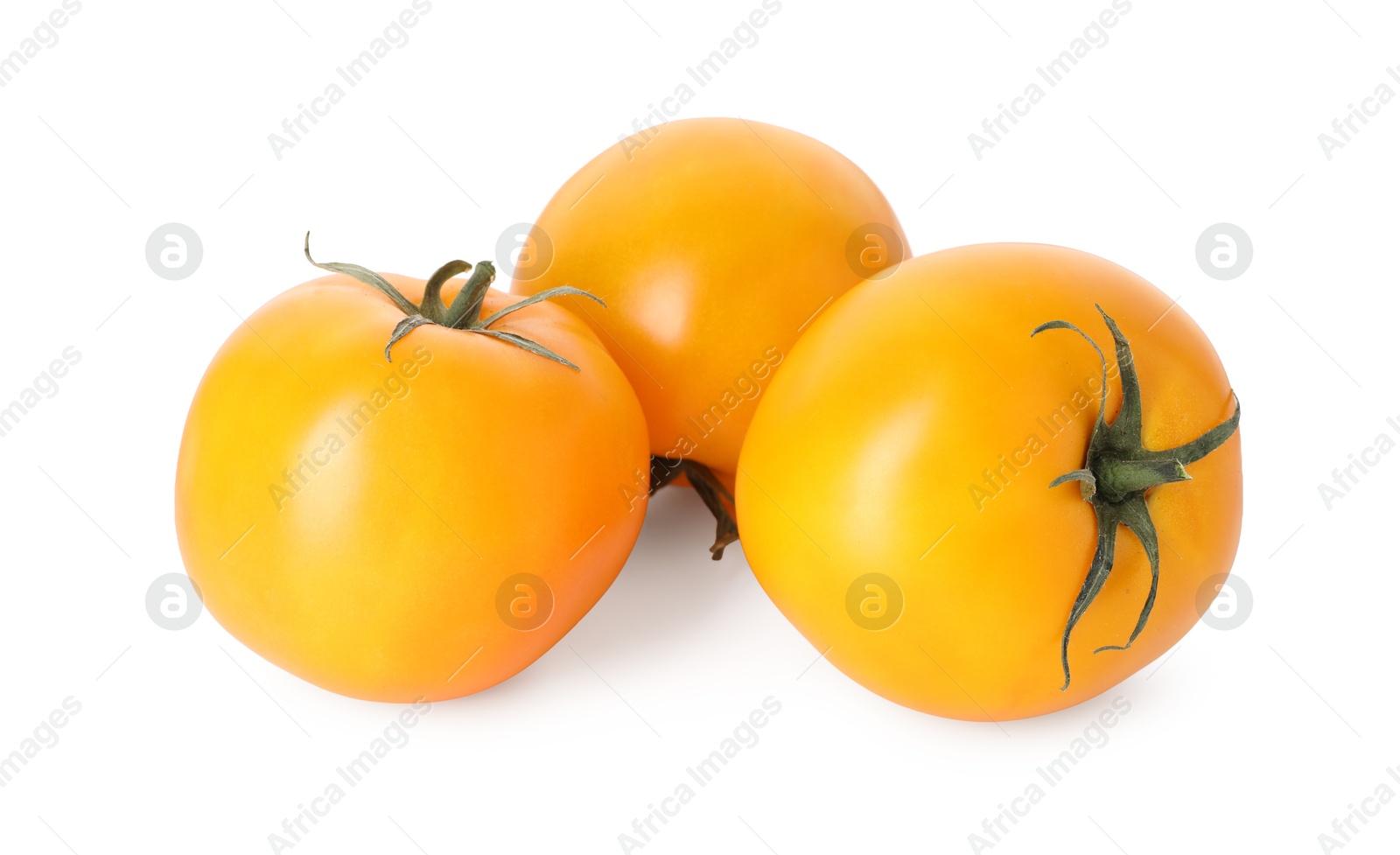 Many ripe yellow tomatoes isolated on white Photo of Many ripe yellow tomatoes isolated on white
